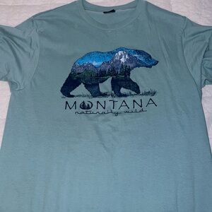Cute Montana shirt. Size Medium and is a blue green color